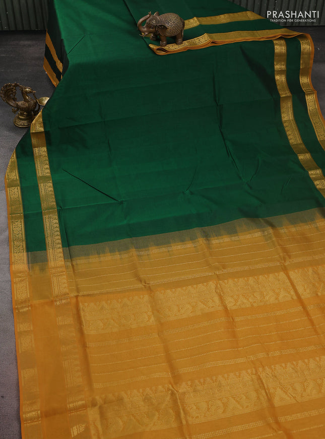 Silk cotton saree dark green and mustard yellow with plain body and rettapet zari woven border
