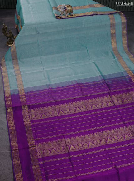 Silk cotton saree teal blue and purple with plain body and rettapet zari woven border