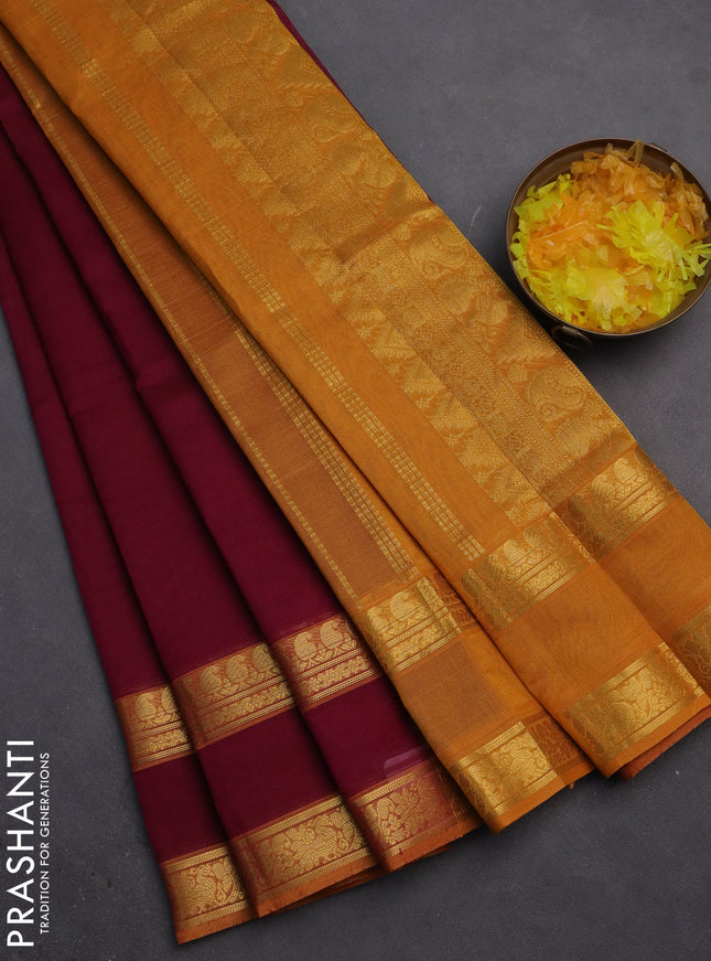 Silk cotton saree dark magenta pink and mustard yellow with plain body and rettapet zari woven border