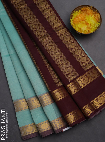 Silk cotton saree teal blue and deep maroon with plain body and rettapet zari woven border