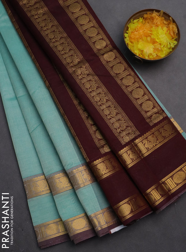 Silk cotton saree teal blue and deep maroon with plain body and rettapet zari woven border