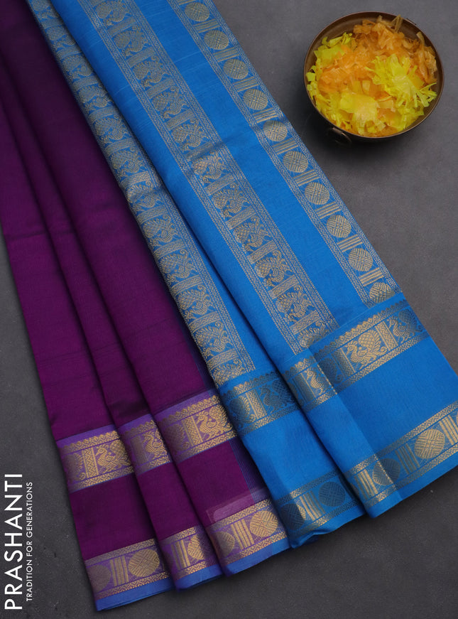 Silk cotton saree purple and cs blue with plain body and rettapet zari woven border