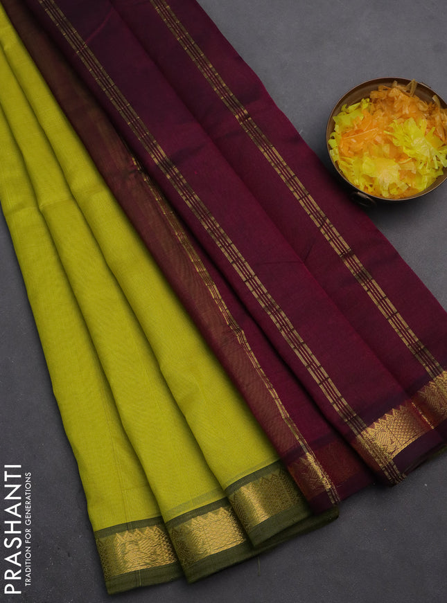 Silk cotton saree lime yellow and purple with plain body and zari woven border