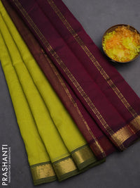 Silk cotton saree lime yellow and purple with plain body and zari woven border