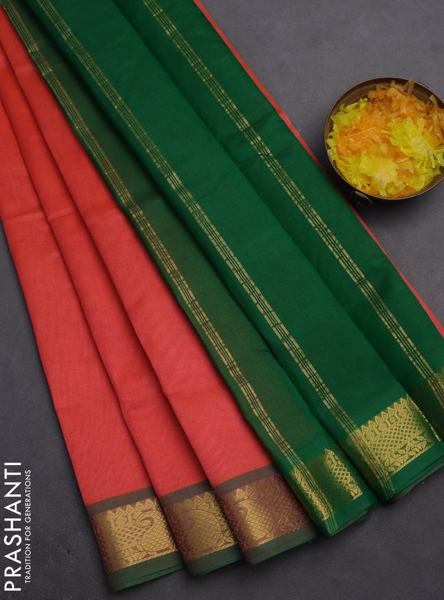 Silk cotton saree dual shade of peach orange and green with plain body and zari woven border