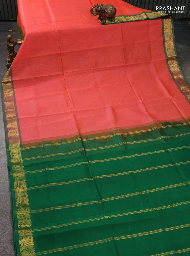 Silk cotton saree dual shade of peach orange and green with plain body and zari woven border