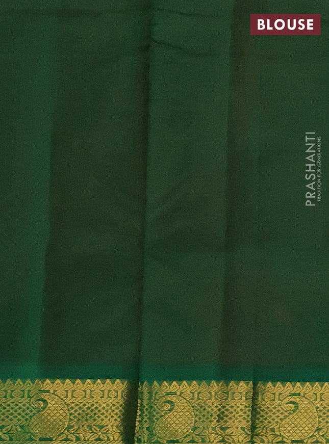 Silk cotton saree dual shade of peach orange and green with plain body and zari woven border