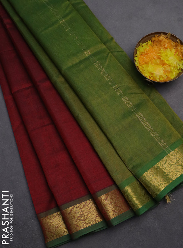 Silk cotton saree maroon and mehendi green with plain body and zari woven border