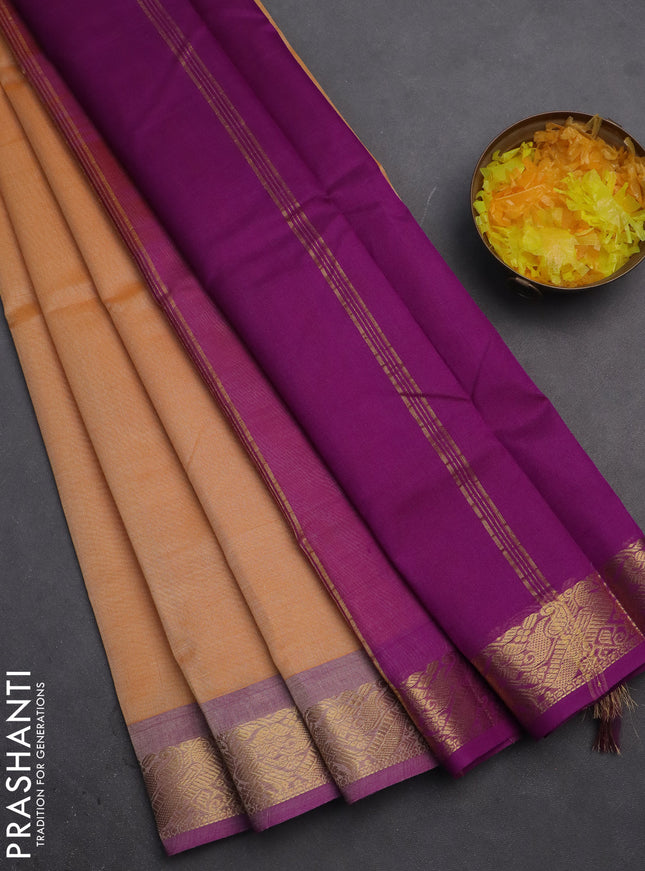 Silk cotton saree pale orange and purple with plain body and zari woven border