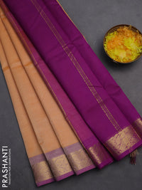 Silk cotton saree pale orange and purple with plain body and zari woven border