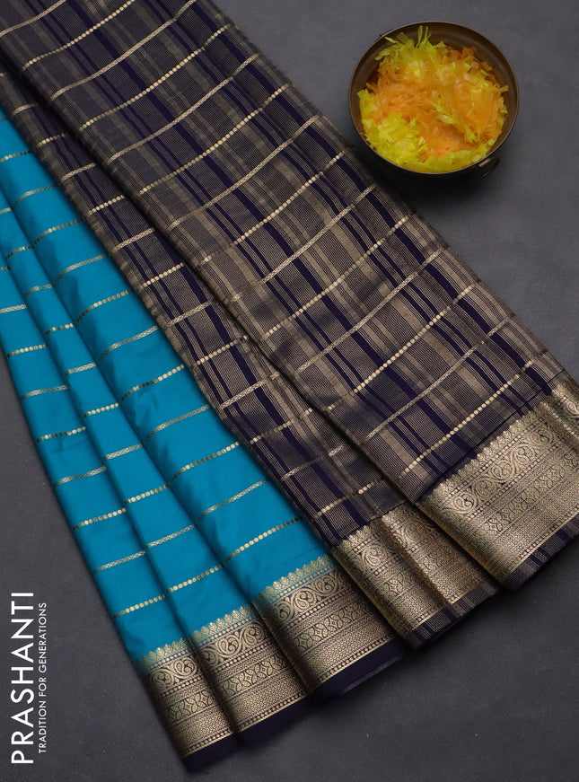 Semi mysore silk saree light blue and navy blue with allover zari woven stripes pattern and zari woven border
