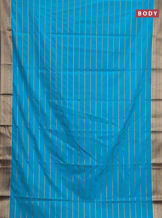 Semi mysore silk saree light blue and navy blue with allover zari woven stripes pattern and zari woven border