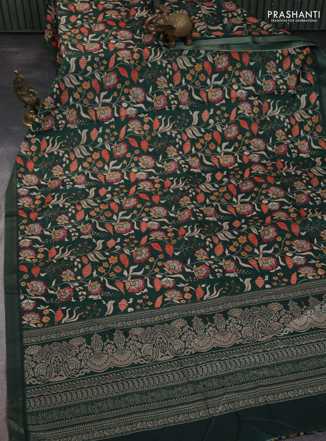 Semi tussar saree bottle green with allover kalamkari prints and zari woven border