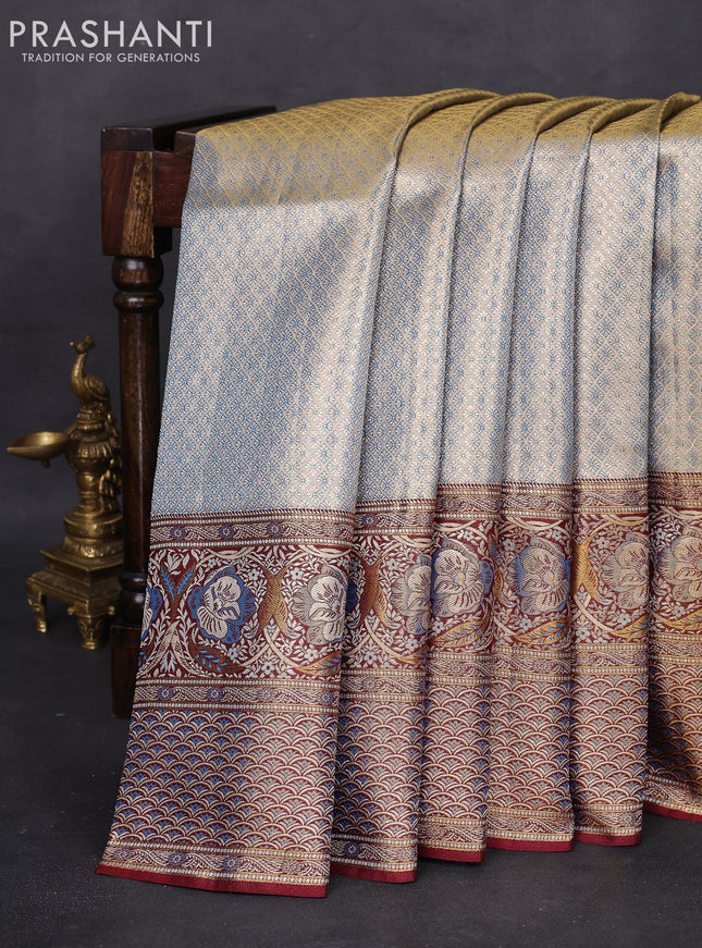 Pure Kanchipuram tissue silk saree dual shade of blue and deep maroon with allover zari woven brocade weaves and long zari woven mina border