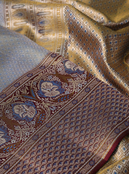 Pure Kanchipuram tissue silk saree dual shade of blue and deep maroon with allover zari woven brocade weaves and long zari woven mina border