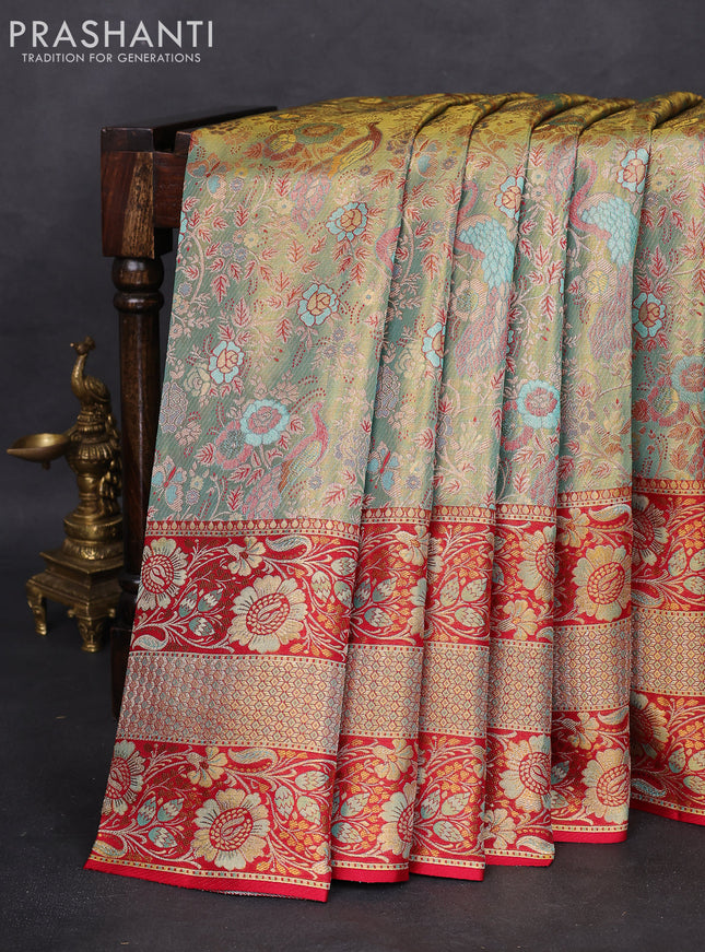 Pure Kanchipuram tissue silk saree dual shade of teal and red with allover zari woven peacock brocade weaves and long zari woven mina border