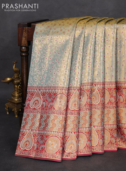 Pure Kanchipuram tissue silk saree dual shade of pastel blue and maroon with allover zari woven brocade weaves and long zari woven border