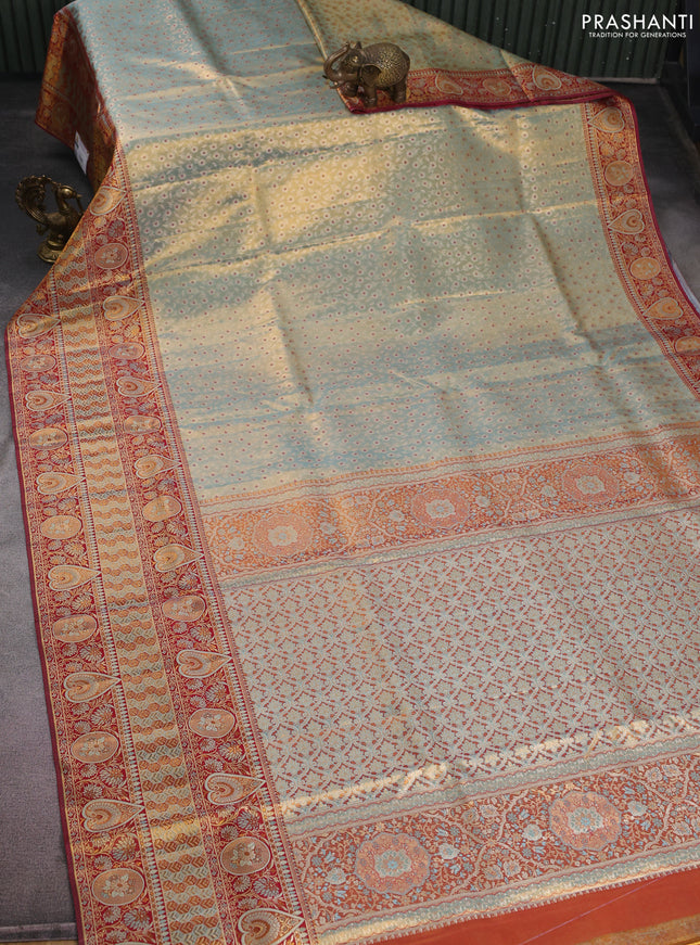 Pure Kanchipuram tissue silk saree dual shade of pastel blue and maroon with allover zari woven brocade weaves and long zari woven border