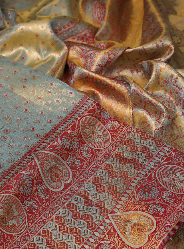 Pure Kanchipuram tissue silk saree dual shade of pastel blue and maroon with allover zari woven brocade weaves and long zari woven border