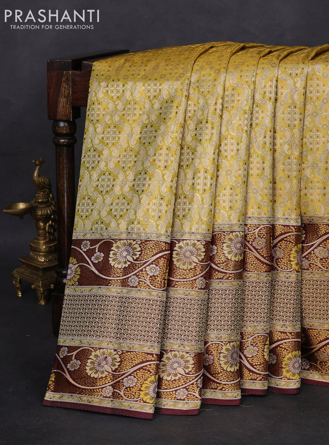 Pure Kanchipuram tissue silk saree lime yellow and brown with allover zari woven brocade weaves and long floral zari woven border