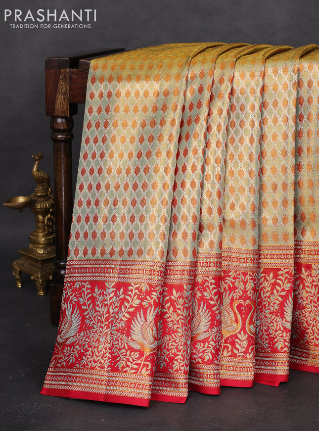 Pure Kanchipuram tissue silk saree dual shade of pastel and red with allover zari woven geometric brocade weaves and zari woven mina border