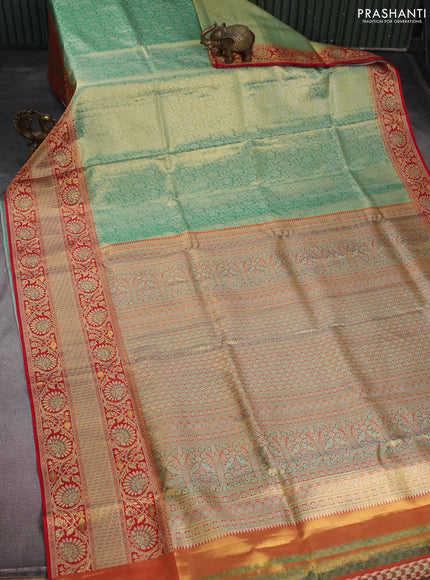 Pure Kanchipuram tissue silk saree dual shade of teal and red with allover silver zari woven brocade weaves and long zari woven border