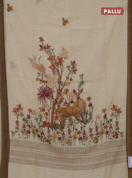 Tissue linen saree cream and green with embroided buttas and kantha stitch embroidery pallu