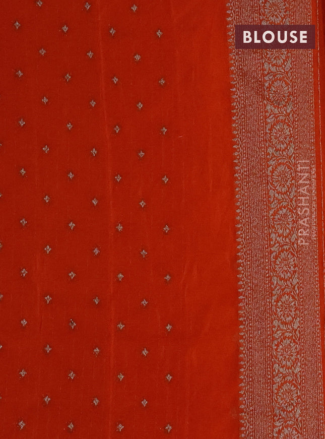 Banarasi semi crepe saree orange with woven buttas and woven border