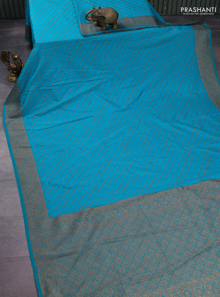 Banarasi semi crepe saree teal blue with allover woven buttas and woven border