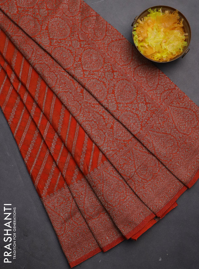 Banarasi semi crepe saree orange with allover stripes pattern and woven border