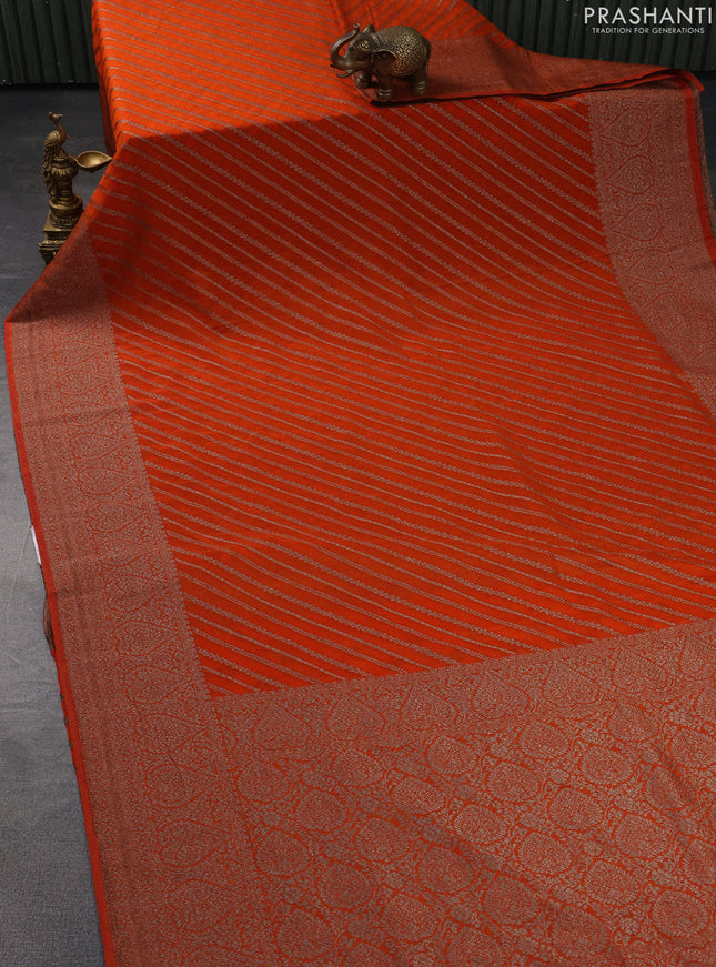 Banarasi semi crepe saree orange with allover stripes pattern and woven border