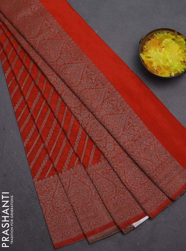 Banarasi semi crepe saree orange with allover stripes pattern and woven border