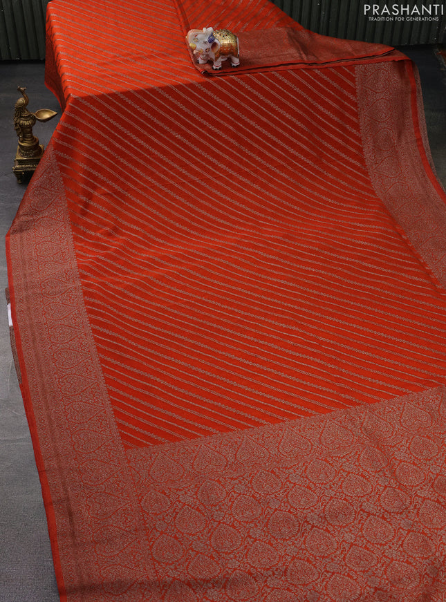 Banarasi semi crepe saree orange with allover stripes pattern and woven border