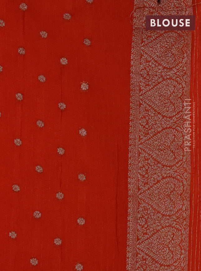 Banarasi semi crepe saree orange with allover stripes pattern and woven border