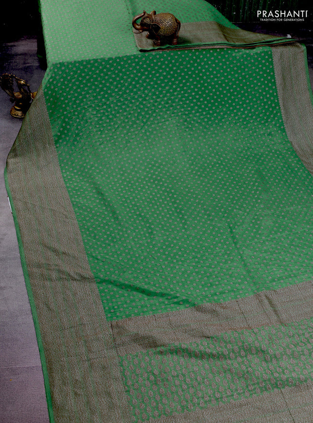 Banarasi semi crepe saree pastel green with woven buttas and woven border