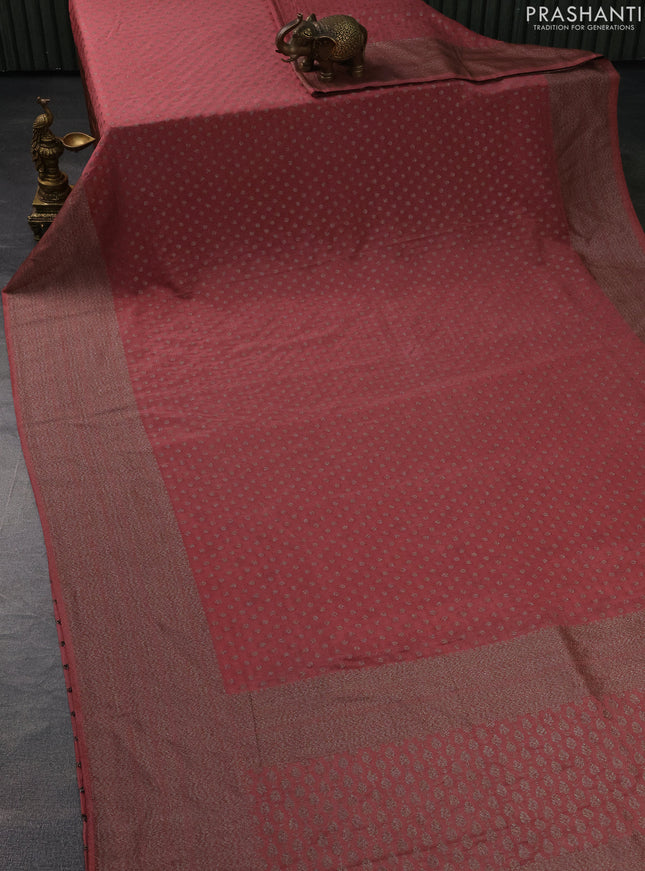 Banarasi semi crepe saree pastel peach with woven buttas and woven border