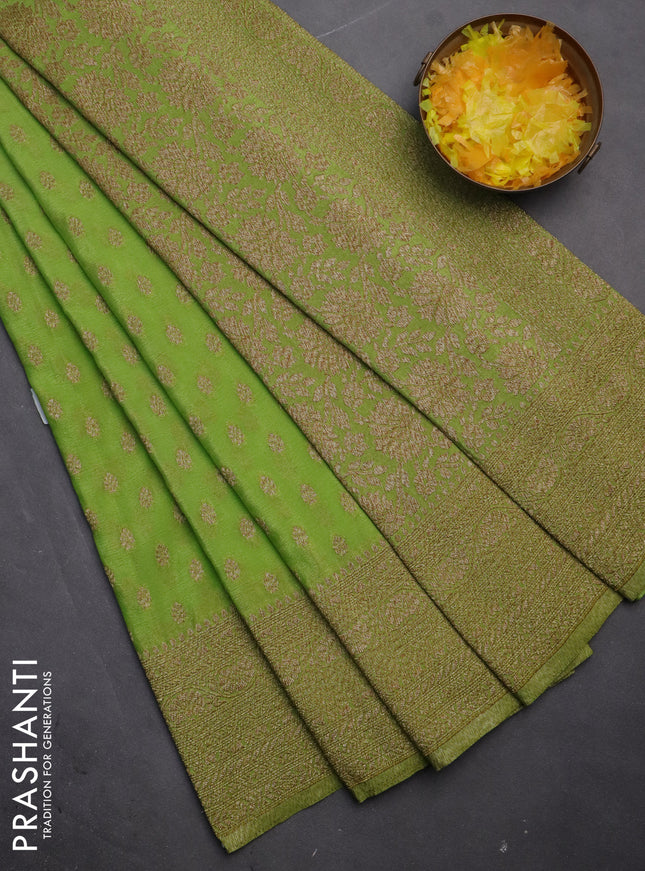Banarasi semi crepe saree light green with woven buttas and woven border