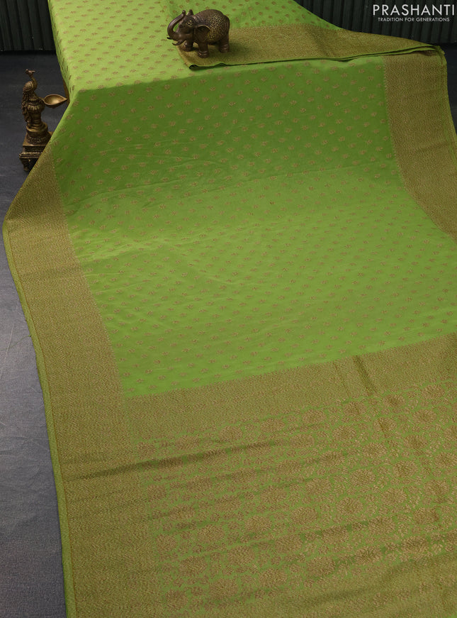 Banarasi semi crepe saree light green with woven buttas and woven border