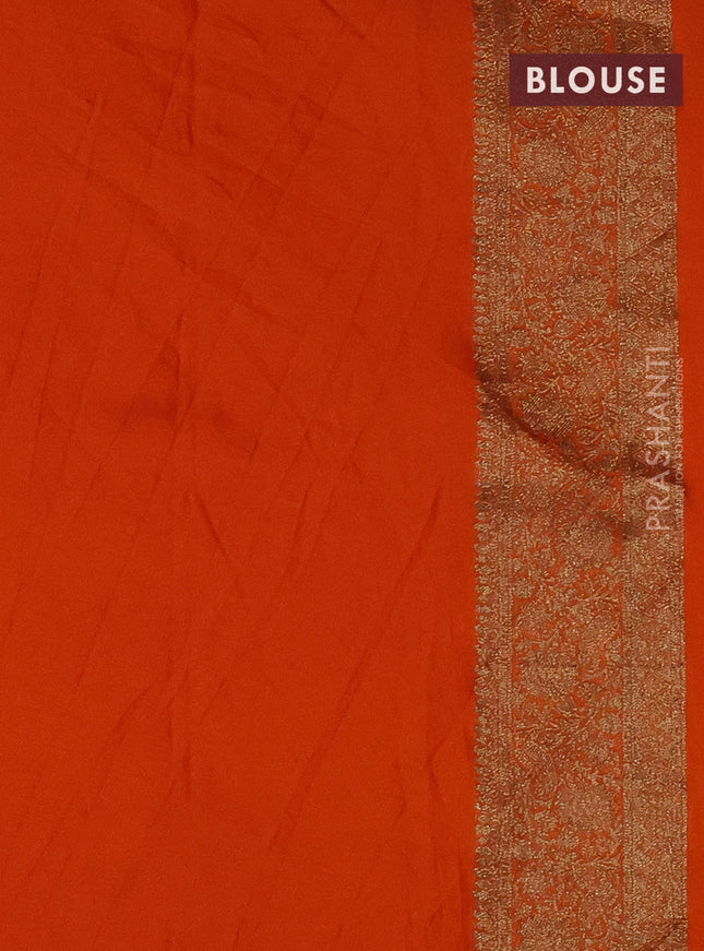 Banarasi semi crepe saree orange with woven buttas and woven border