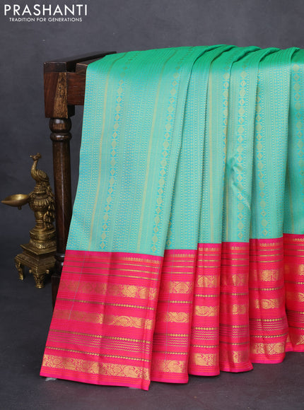 Pure kanchipuram silk saree teal green and pink with allover zari woven brocade weaves and zari woven korvai border