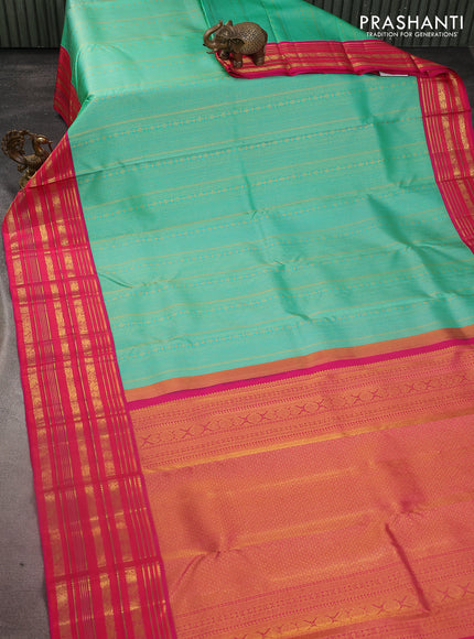 Pure kanchipuram silk saree teal green and pink with allover zari woven brocade weaves and zari woven korvai border