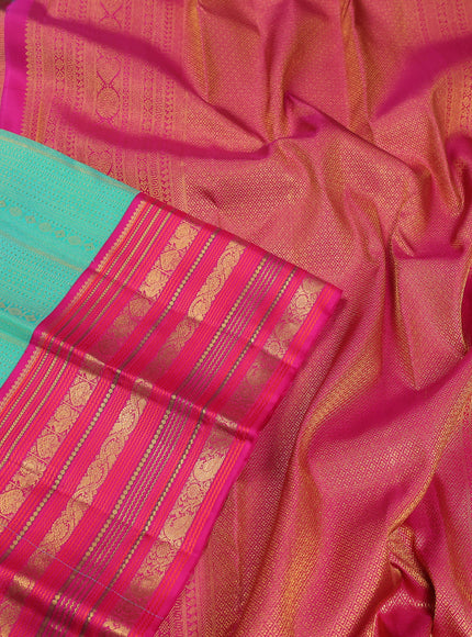 Pure kanchipuram silk saree teal green and pink with allover zari woven brocade weaves and zari woven korvai border