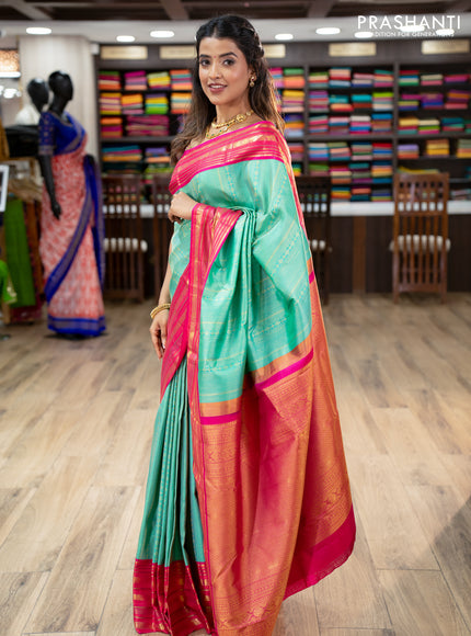 Pure kanchipuram silk saree teal green and pink with allover zari woven brocade weaves and zari woven korvai border