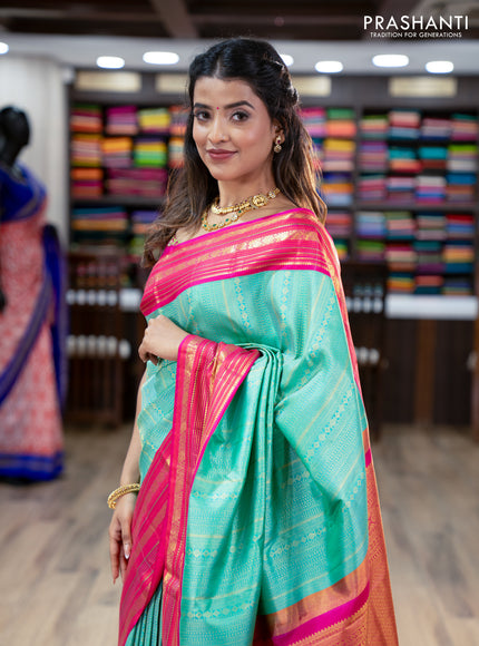Pure kanchipuram silk saree teal green and pink with allover zari woven brocade weaves and zari woven korvai border