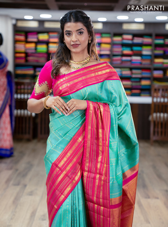 Pure kanchipuram silk saree teal green and pink with allover zari woven brocade weaves and zari woven korvai border