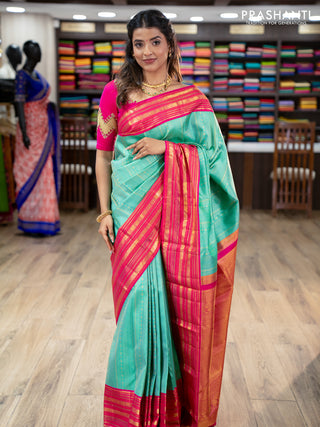 Pure kanchipuram silk saree teal green and pink with allover zari woven brocade weaves and zari woven korvai border