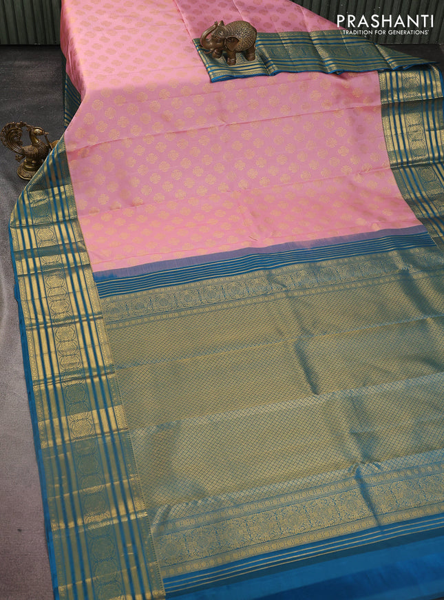 Pure kanchipuram silk saree peach pink and peacock blue with zari woven buttas and zari woven korvai border