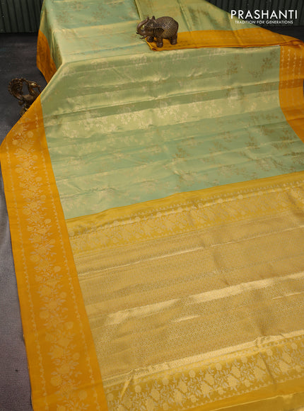 Pure kanchipuram Tissue silk saree pista green and mustard yellow with allover zari weaves and floral design zari border