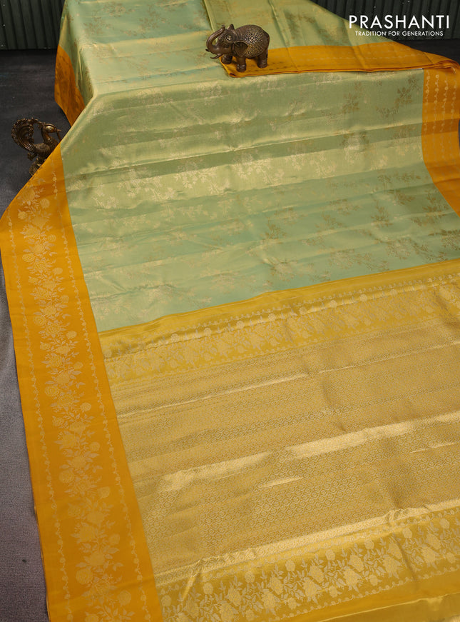 Pure kanchipuram Tissue silk saree pista green and mustard yellow with allover zari weaves and floral design zari border
