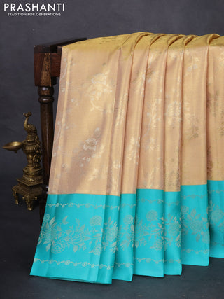 Pure kanchipuram Tissue silk saree gold and teal green with allover zari weaves and floral design zari border